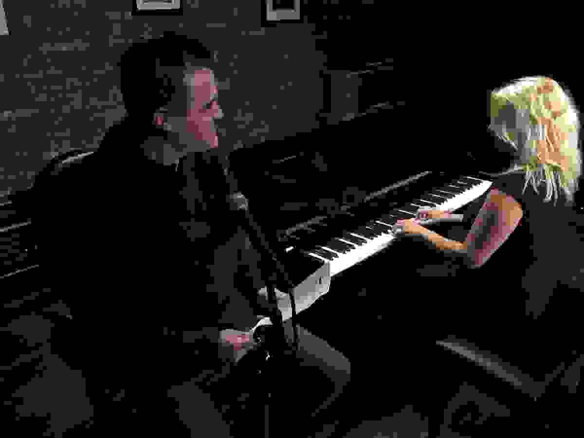 Working on marketing content at the piano