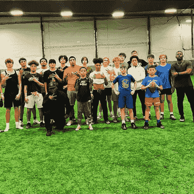 Group of football instructors and football players