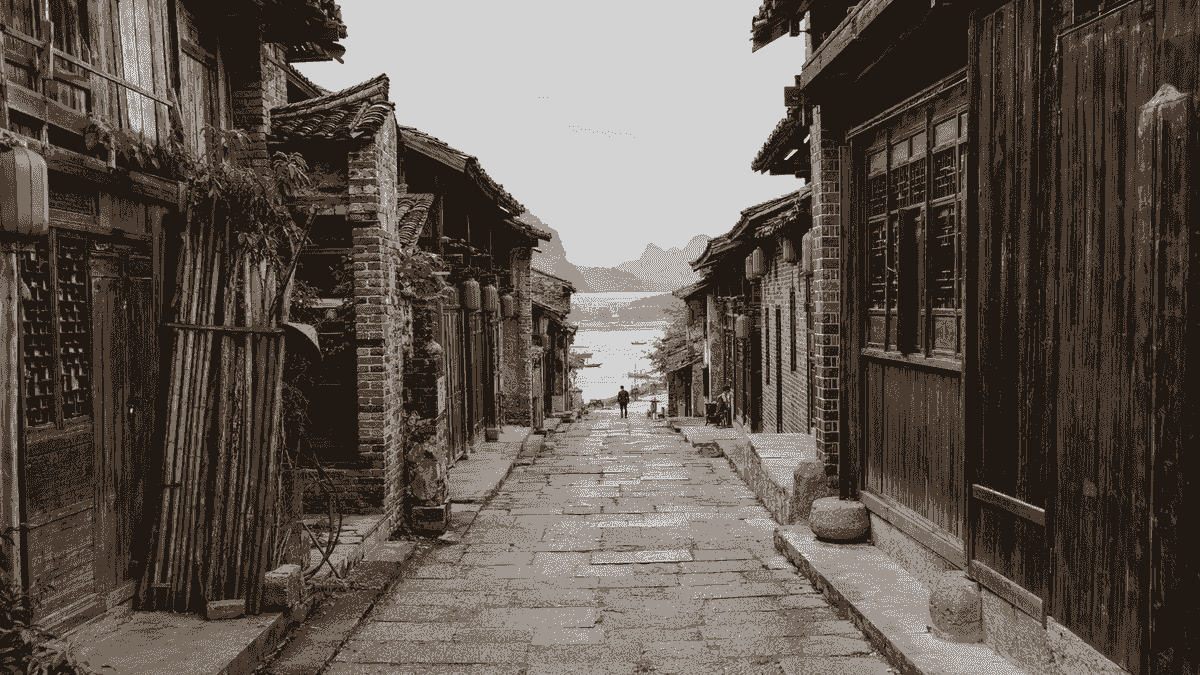 Stone-paved lane and traditional wooden houses in Daxu Ancient Town near Guilin Stone-paved lane and traditional wooden houses in Daxu Ancient Town near Guilin