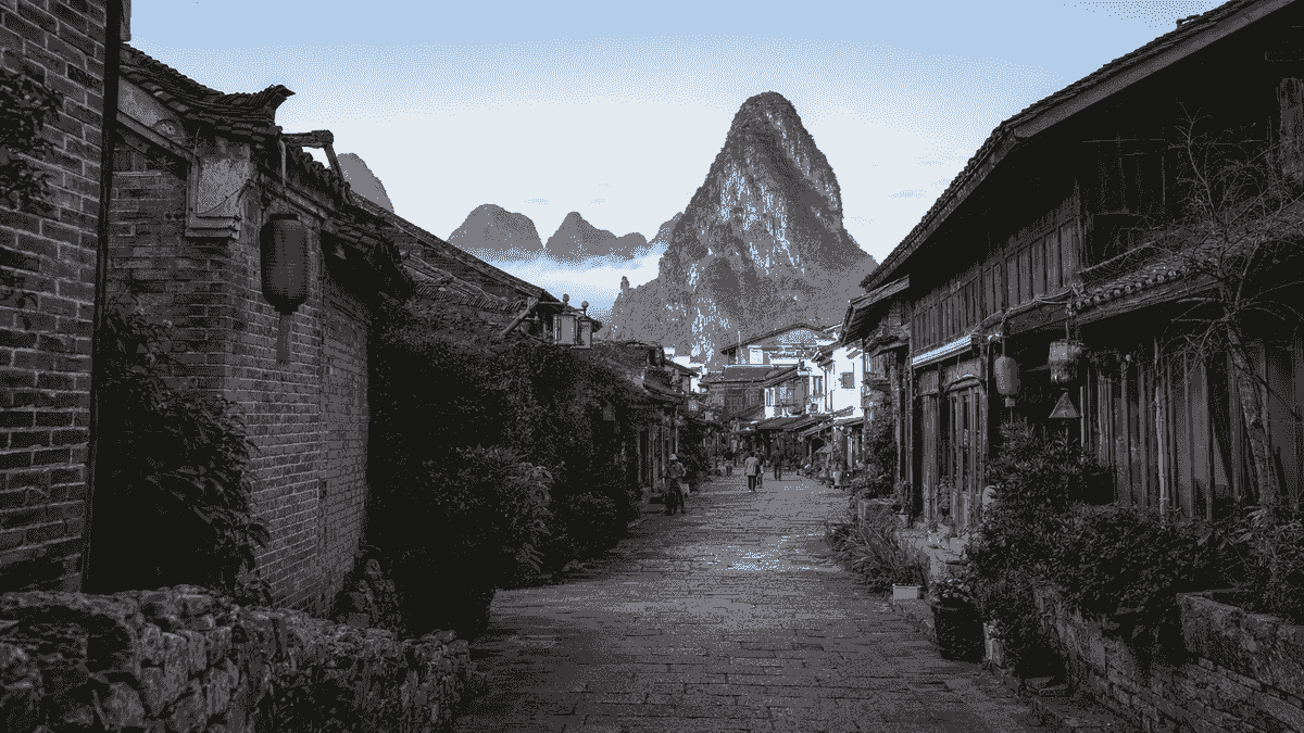 Traditional stone street and karst mountain scenery in Xingping Ancient Town Traditional stone street and karst mountain scenery in Xingping Ancient Town