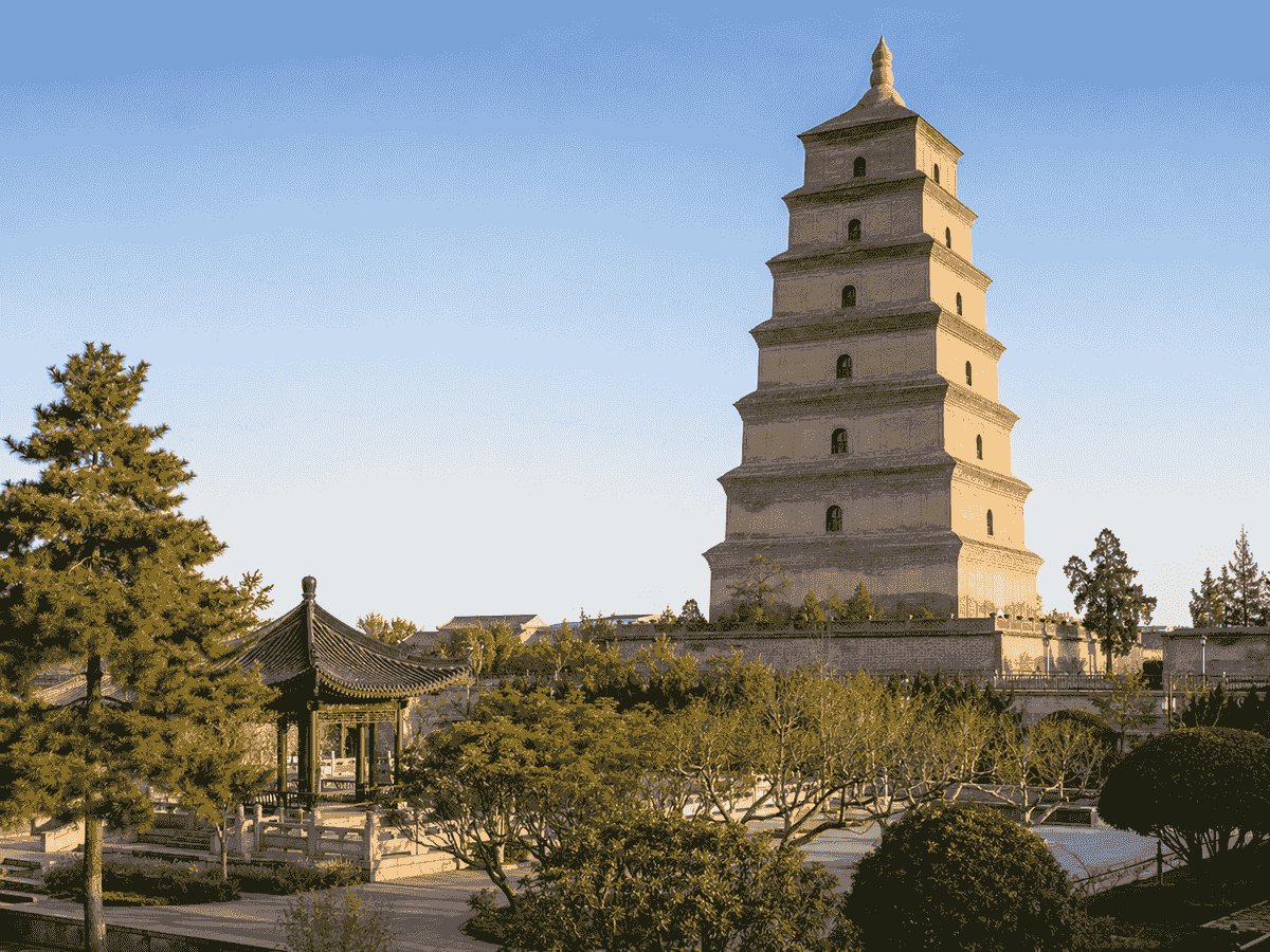 Big Wild Goose Pagoda rising above landscaped gardens in Xi’an during golden morning light. Big Wild Goose Pagoda rising above landscaped gardens in Xi’an during golden morning light.