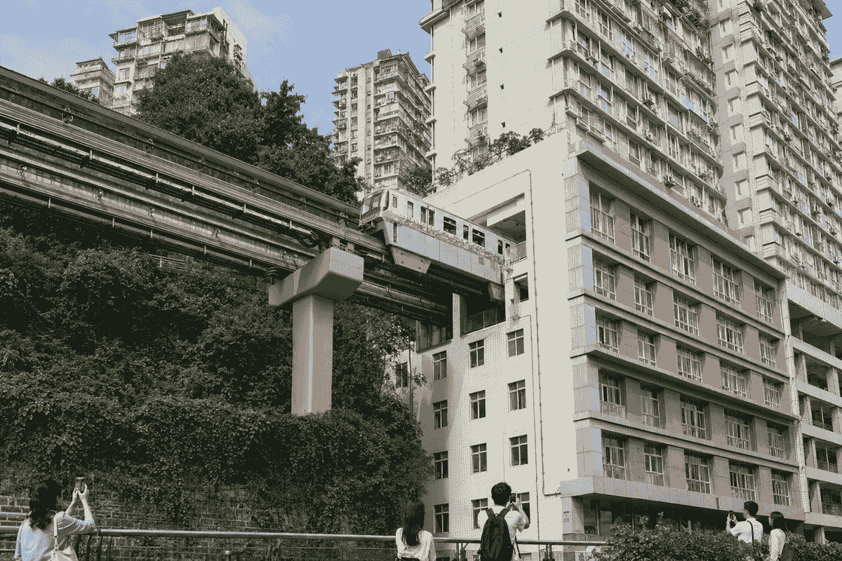 Chongqing monorail train passing through the Liziba Station residential building Chongqing monorail train passing through the Liziba Station residential building