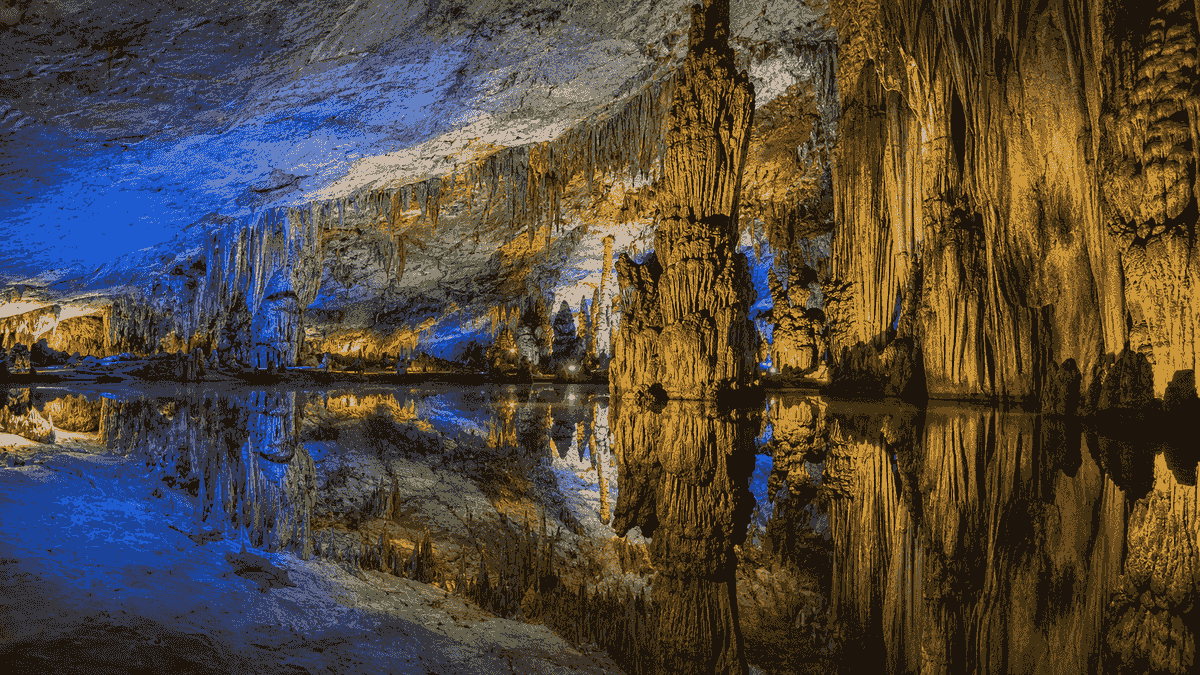Colorful stalactites and underground reflections inside Reed Flute Cave in Guilin Colorful stalactites and underground reflections inside Reed Flute Cave in Guilin