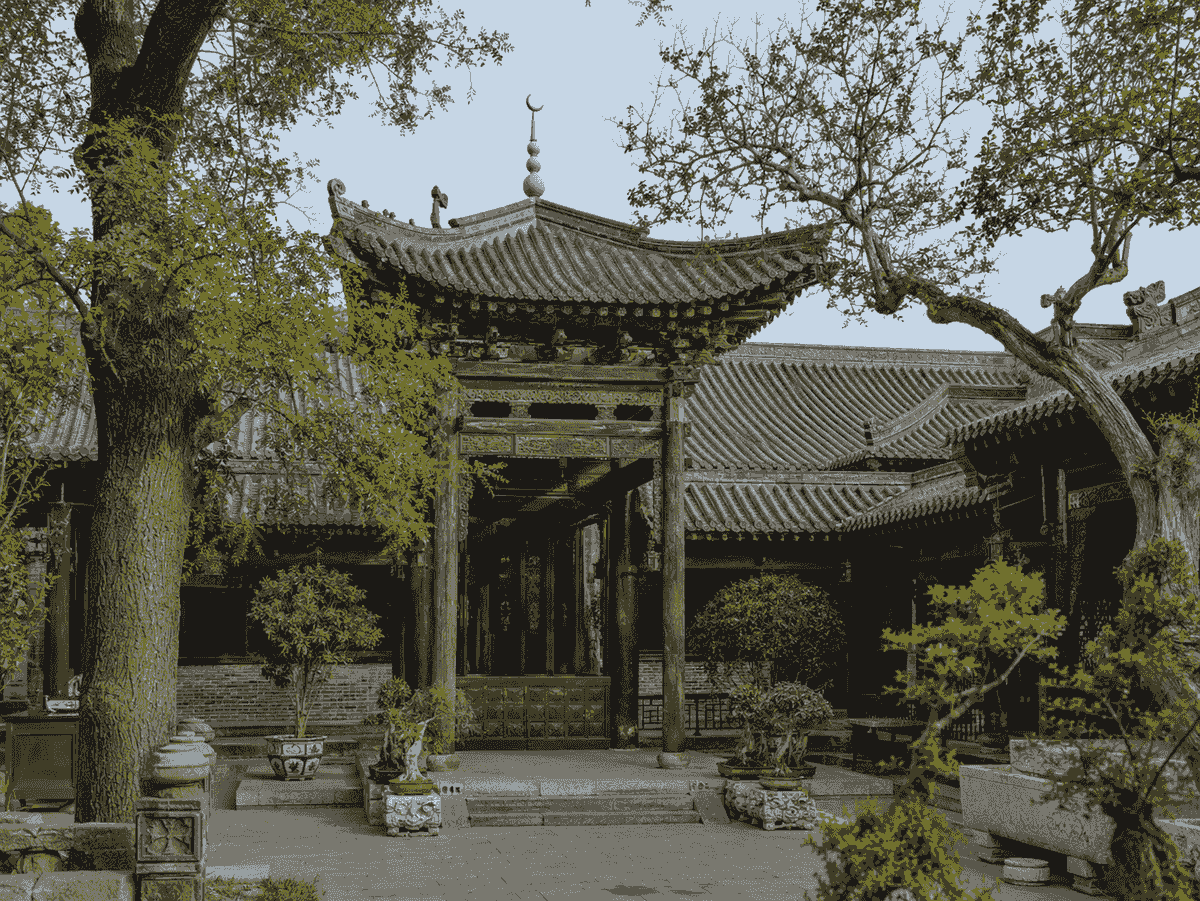 Traditional Chinese courtyard and tiled pavilion inside the Great Mosque of Xi’an. Traditional Chinese courtyard and tiled pavilion inside the Great Mosque of Xi’an.