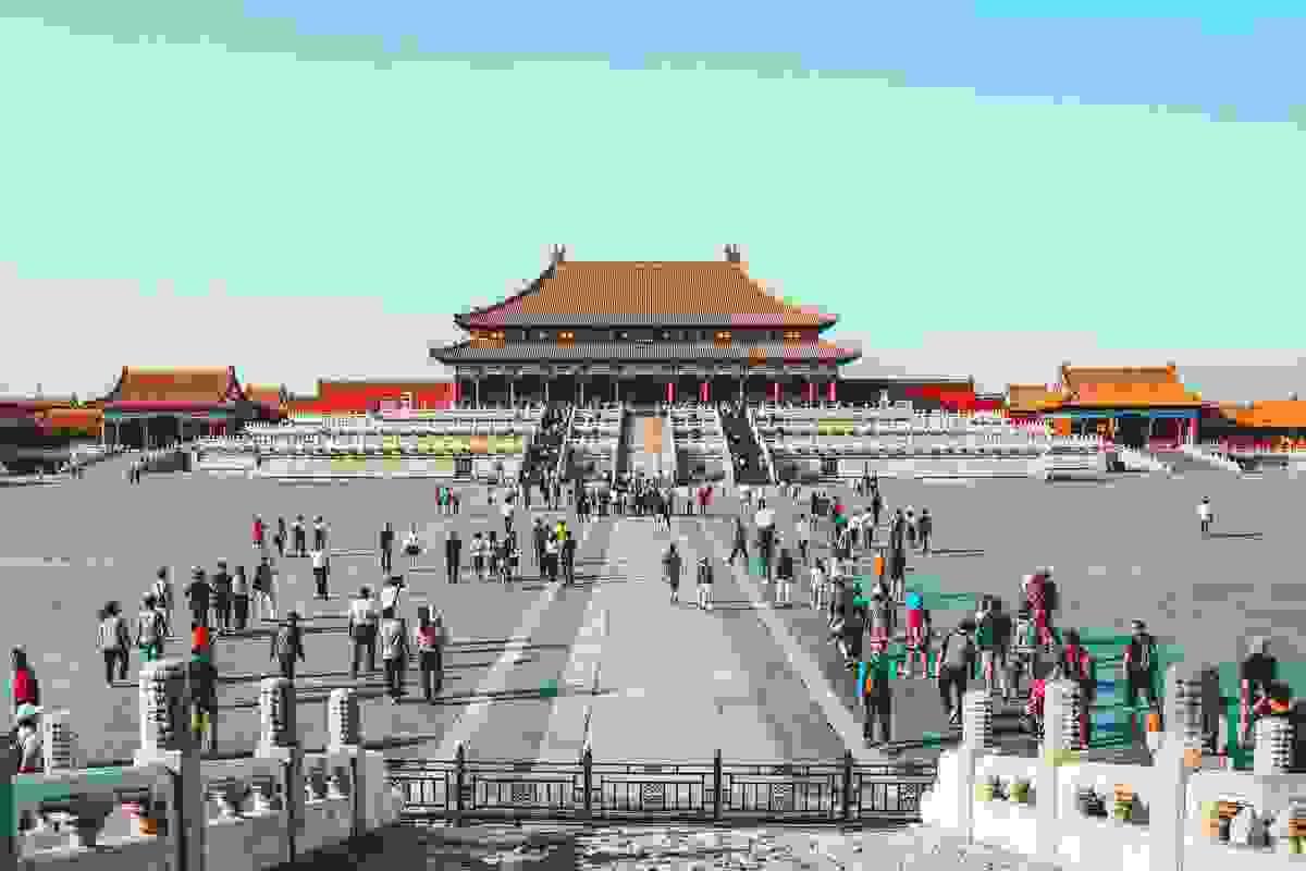 Panoramic view of the Forbidden City's sprawling golden-roofed halls from a high vantage point Panoramic view of the Forbidden City's sprawling golden-roofed halls from a high vantage point