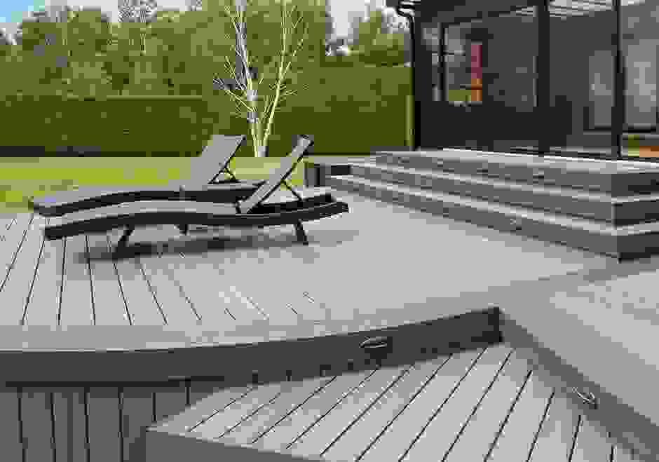 Low maintenance backyards featuring timber decking vs artificial lawn