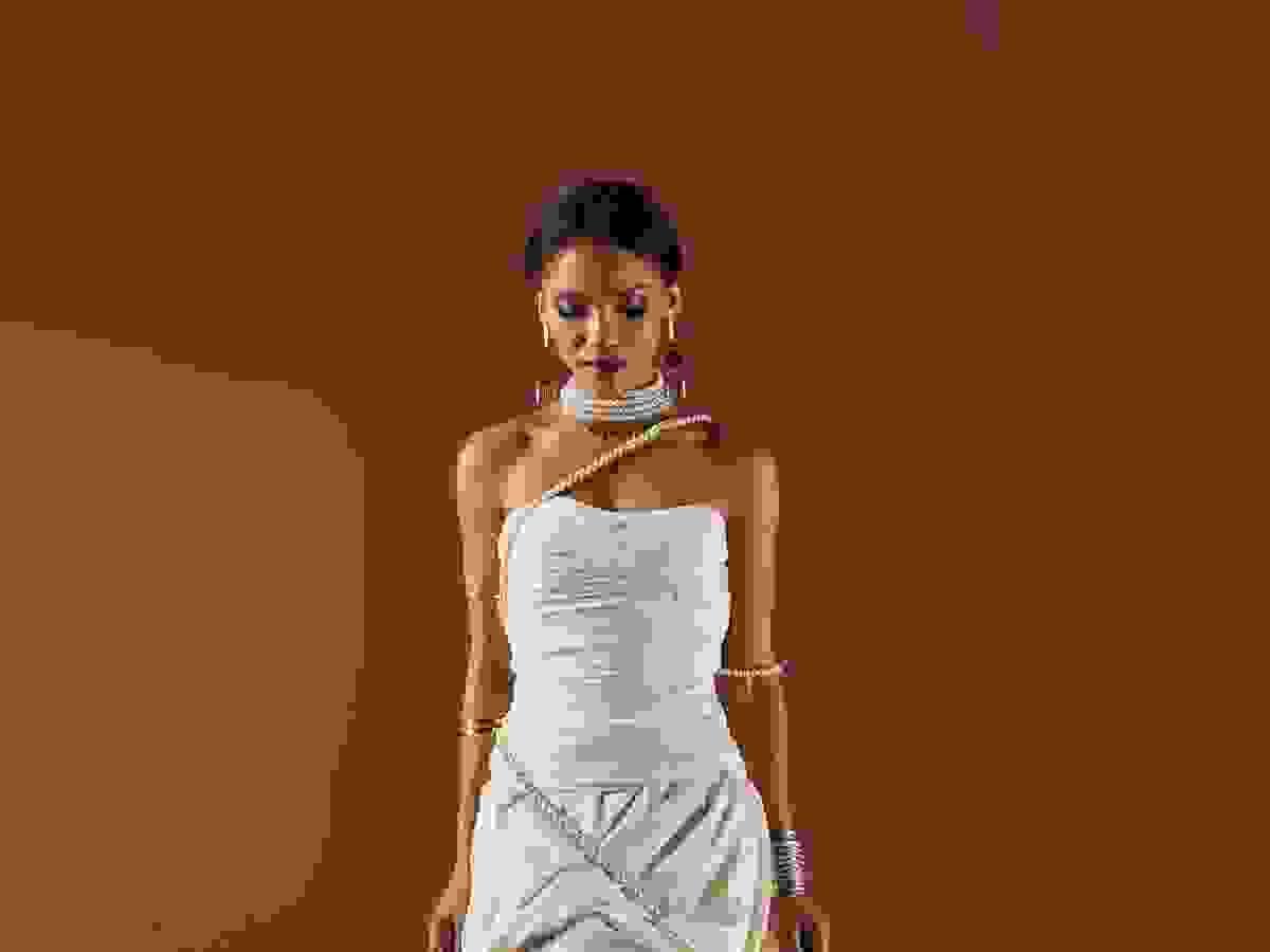 Stylish necklace for off the shoulder dress enhances overall look.