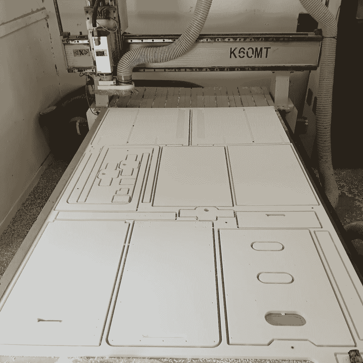 HDPE Plastic being cut for a cabinet with the CNC HDPE Plastic being cut for a cabinet with the CNC