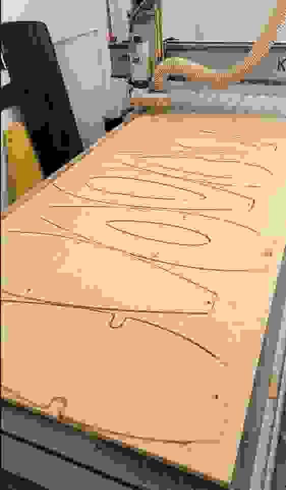 HDPE Plastic being cut for a cabinet with the CNC HDPE Plastic being cut for a cabinet with the CNC
