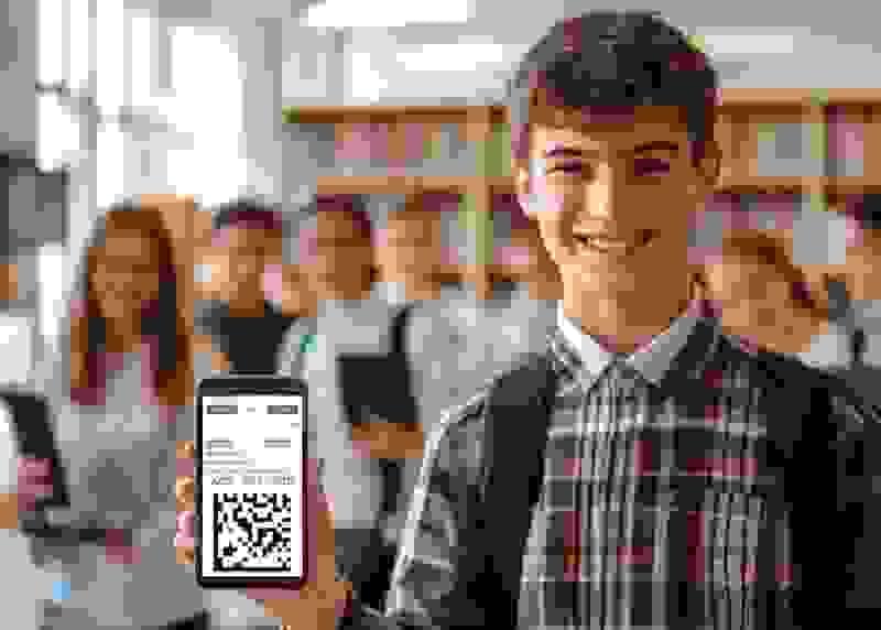 Student showing Snapizzi QR code on a smartphone in a school photo environment, demonstrating high-volume photography automation Student showing Snapizzi QR code on a smartphone in a school photo environment, demonstrating high-volume photography automation