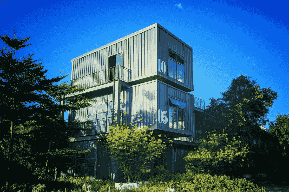 Modern prefabricated shipping container home with solar panels