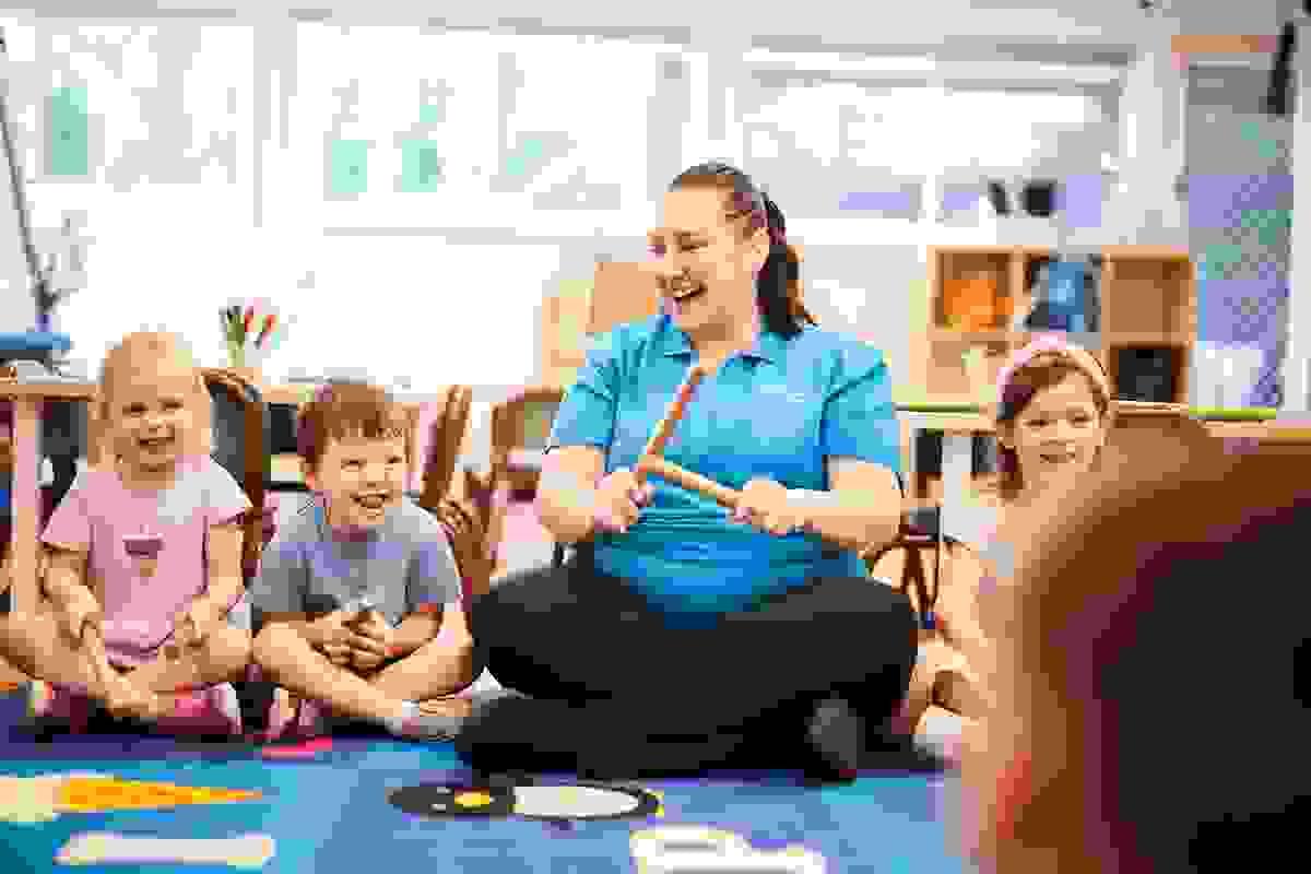 Educator leading a group session with preschool children Educator leading a group session with preschool children