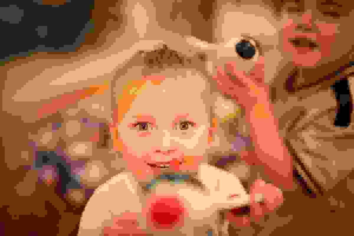 Smiling child playing with a toy Smiling child playing with a toy