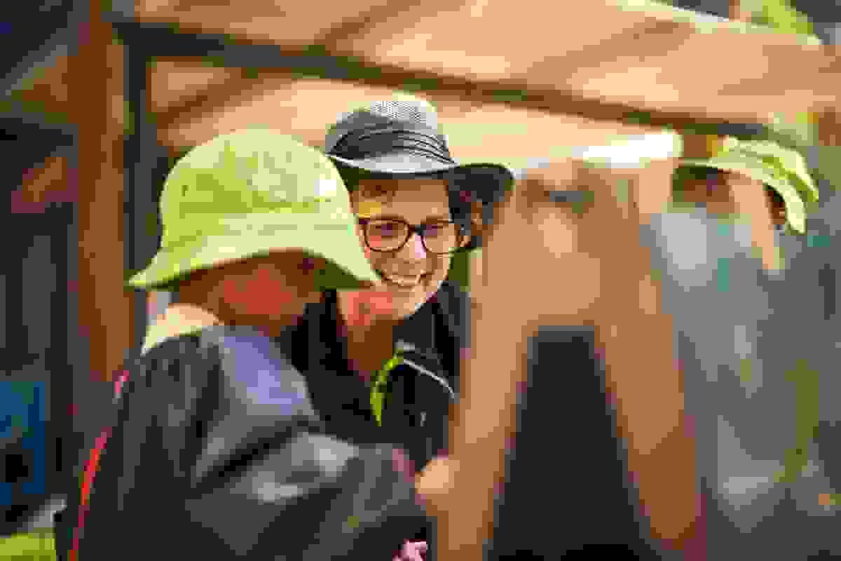 Educator painting with a child outdoors Educator painting with a child outdoors