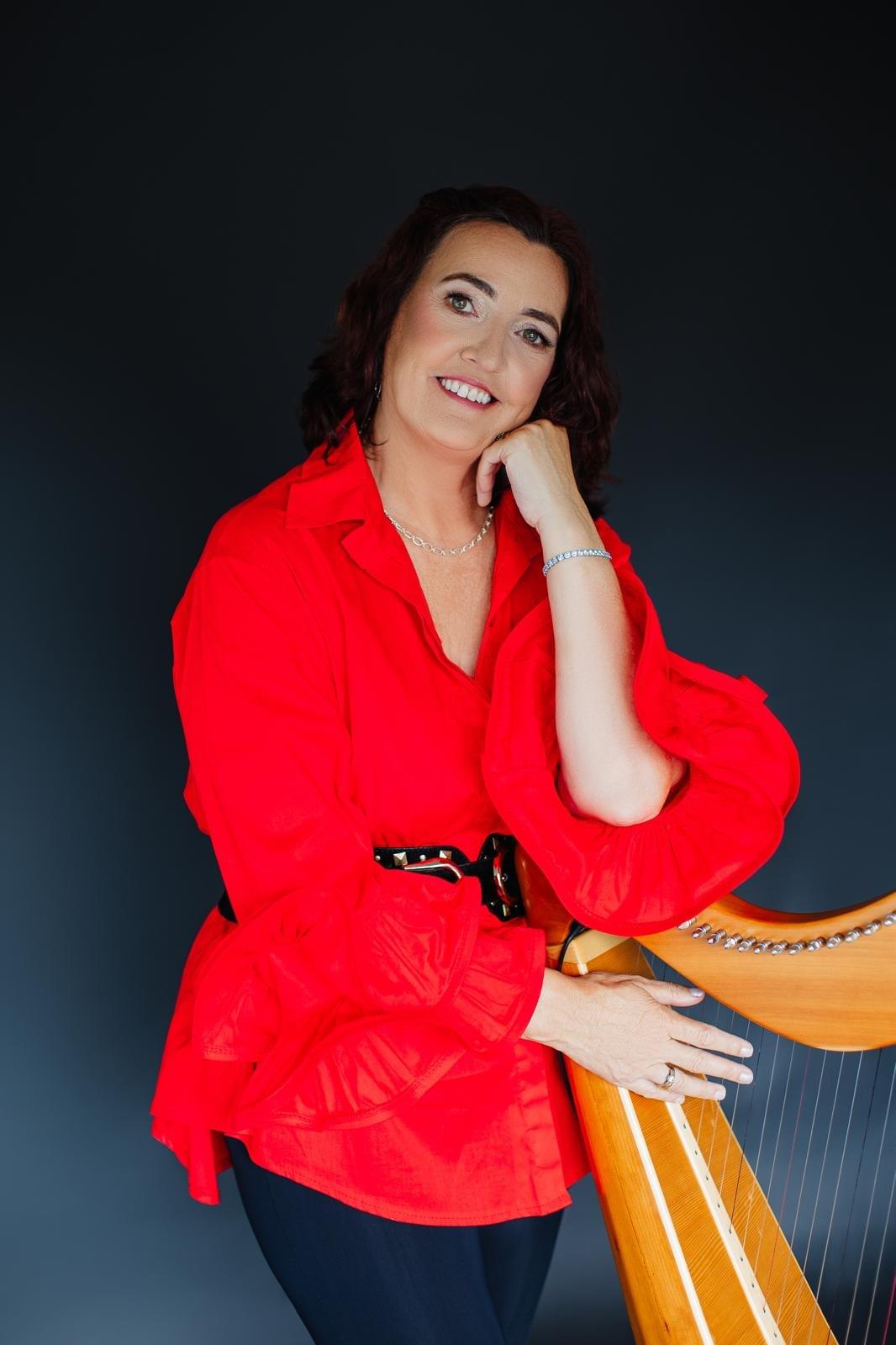 Áine McCarthy-Kent using music as a coaching tool with a harp, life coaching and mentoring for young people to encourage emotional expression and personal growth. Áine McCarthy-Kent using music as a coaching tool with a harp, life coaching and mentoring for young people to encourage emotional expression and personal growth.