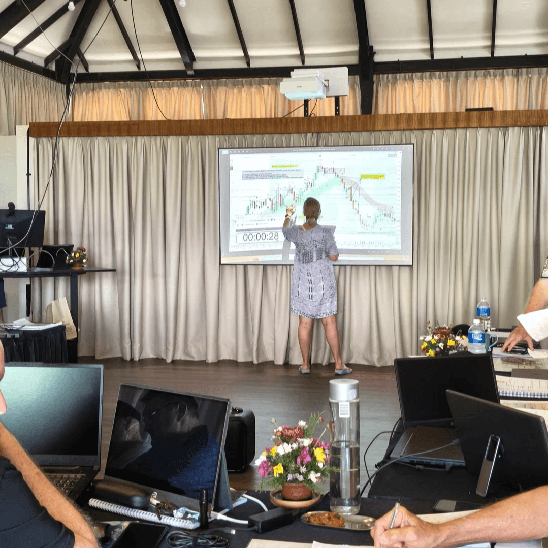 Woman at the projector screen during a trading retreat in The Zone at Spaces Bali