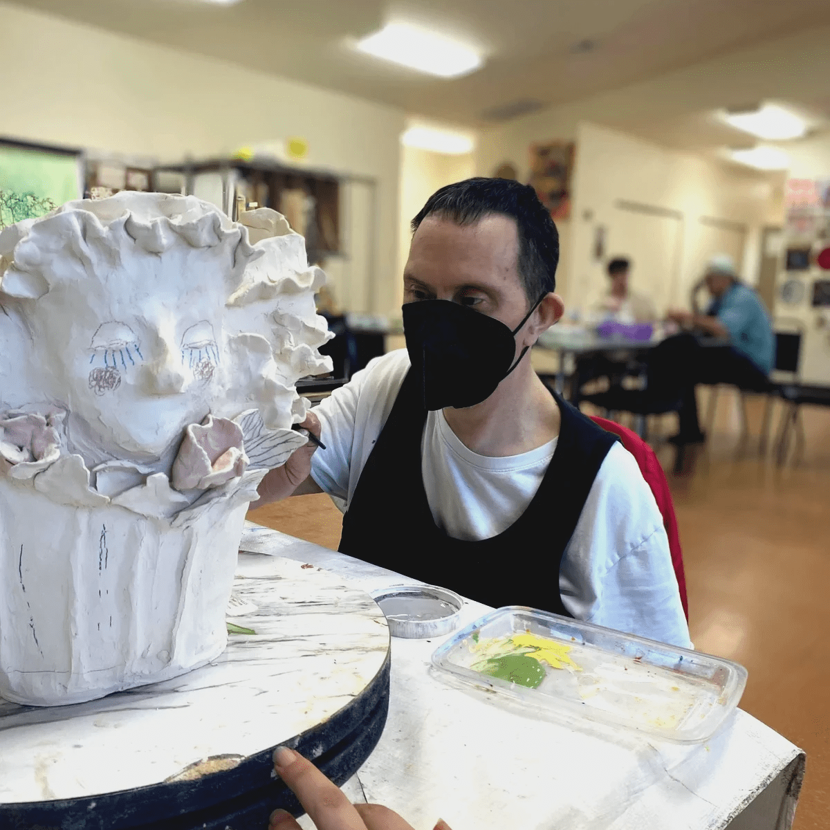 Artist Alex Russnogle displaying art.