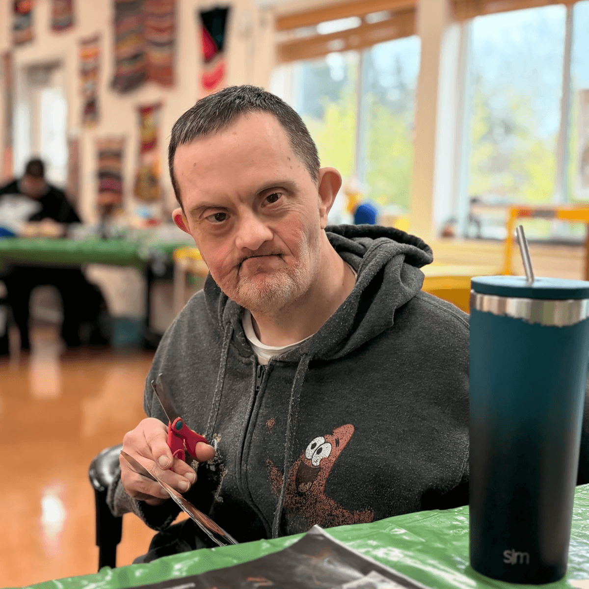 Artist Alex Russnogle working on a collage