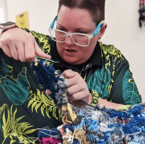 Artist Grant Pattieshaw displaying art.