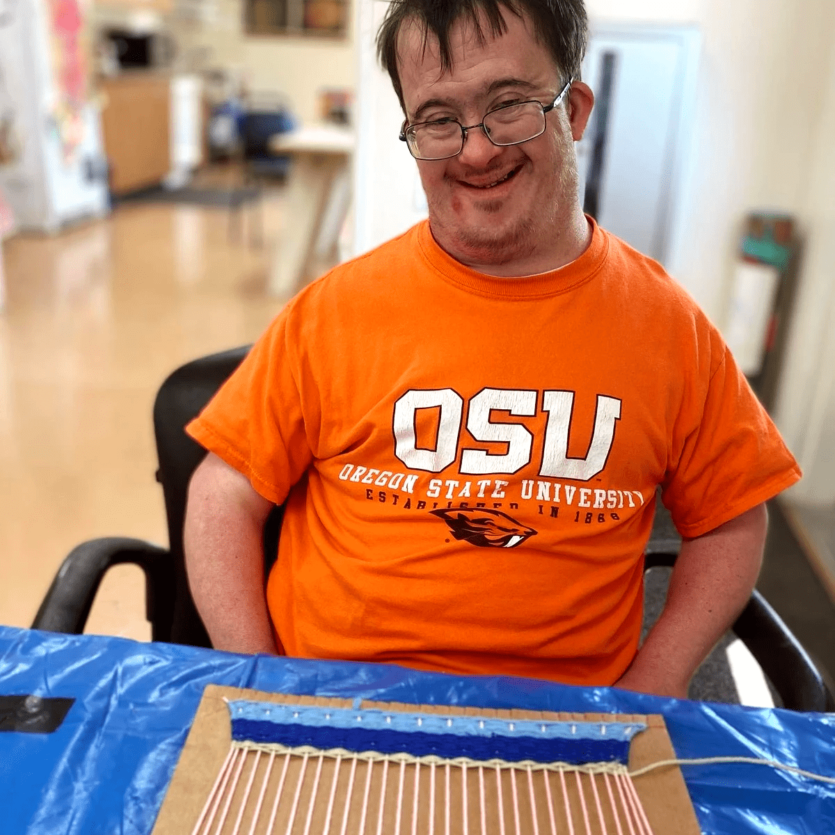 Artist Daniel McKay smiling.