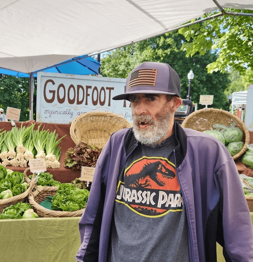 Artist Rodger Hancock displaying art.