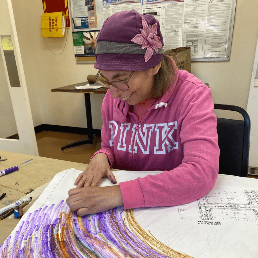 Artist Bonnie Wald displaying art.