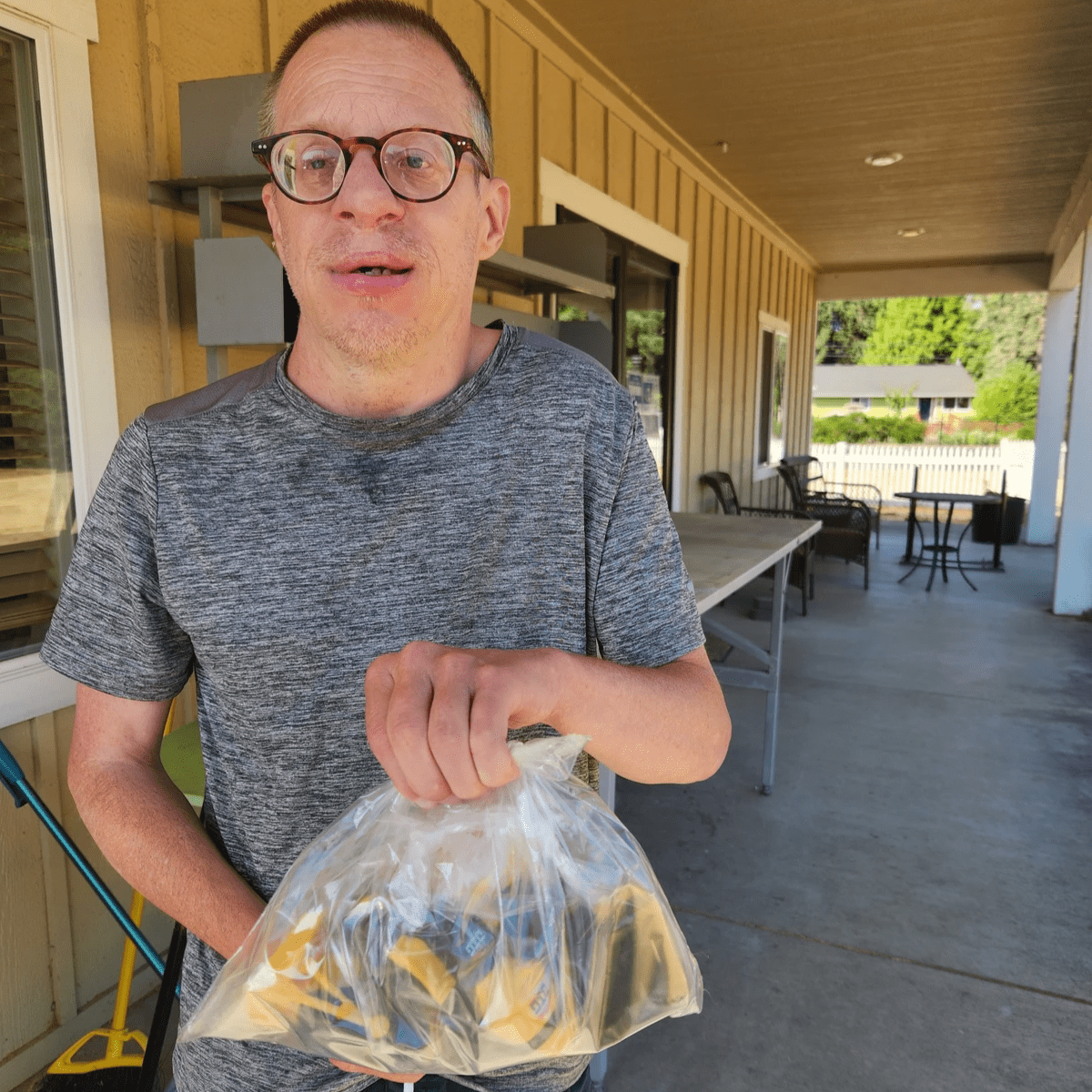 Artist Dennis Baisinger displaying art.