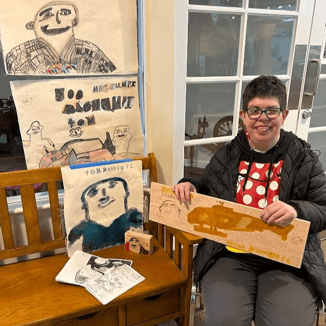 Artist Doreen Beckstead displaying art.