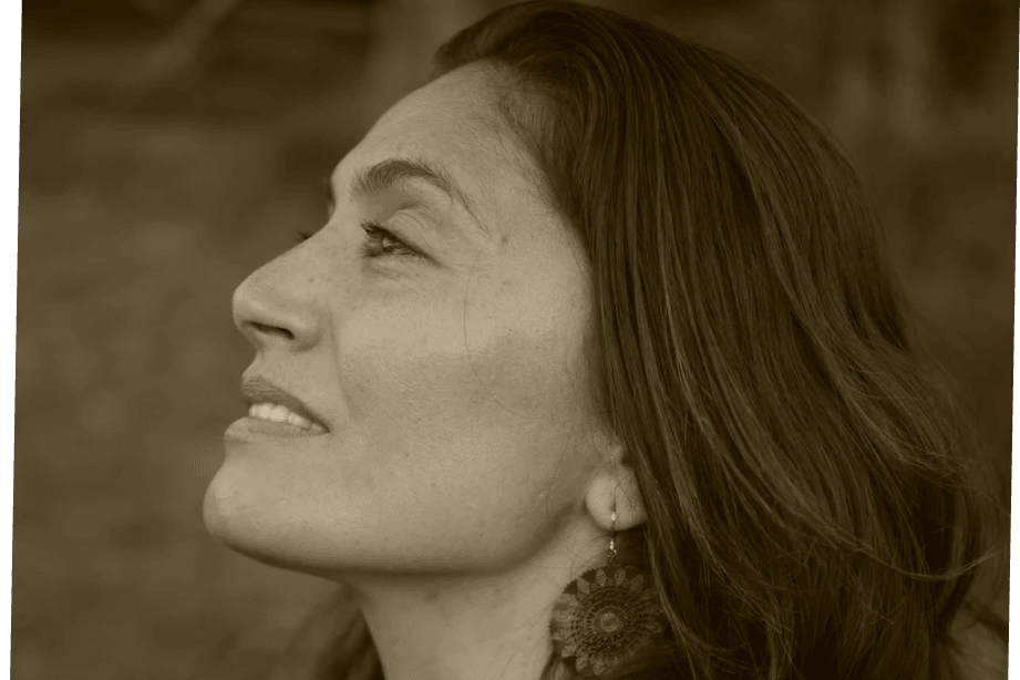 Portrait of Serena, founder of Tomato Love, in profile reflecting on the garden, whenua, and a journey into seed saving in Aotearoa.