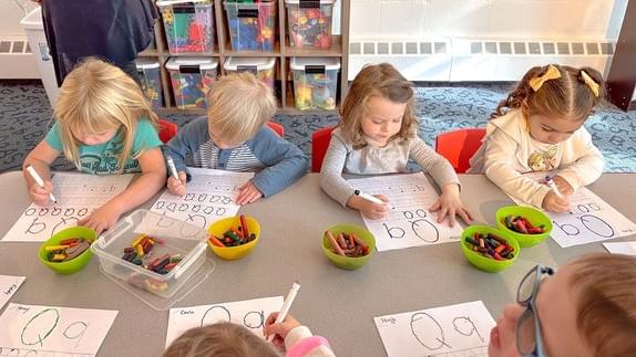 Preschool children practicing letters and numbers at Ballston Children’s Center daycare in Arlington, VA Preschool children practicing letters and numbers at Ballston Children’s Center daycare in Arlington, VA