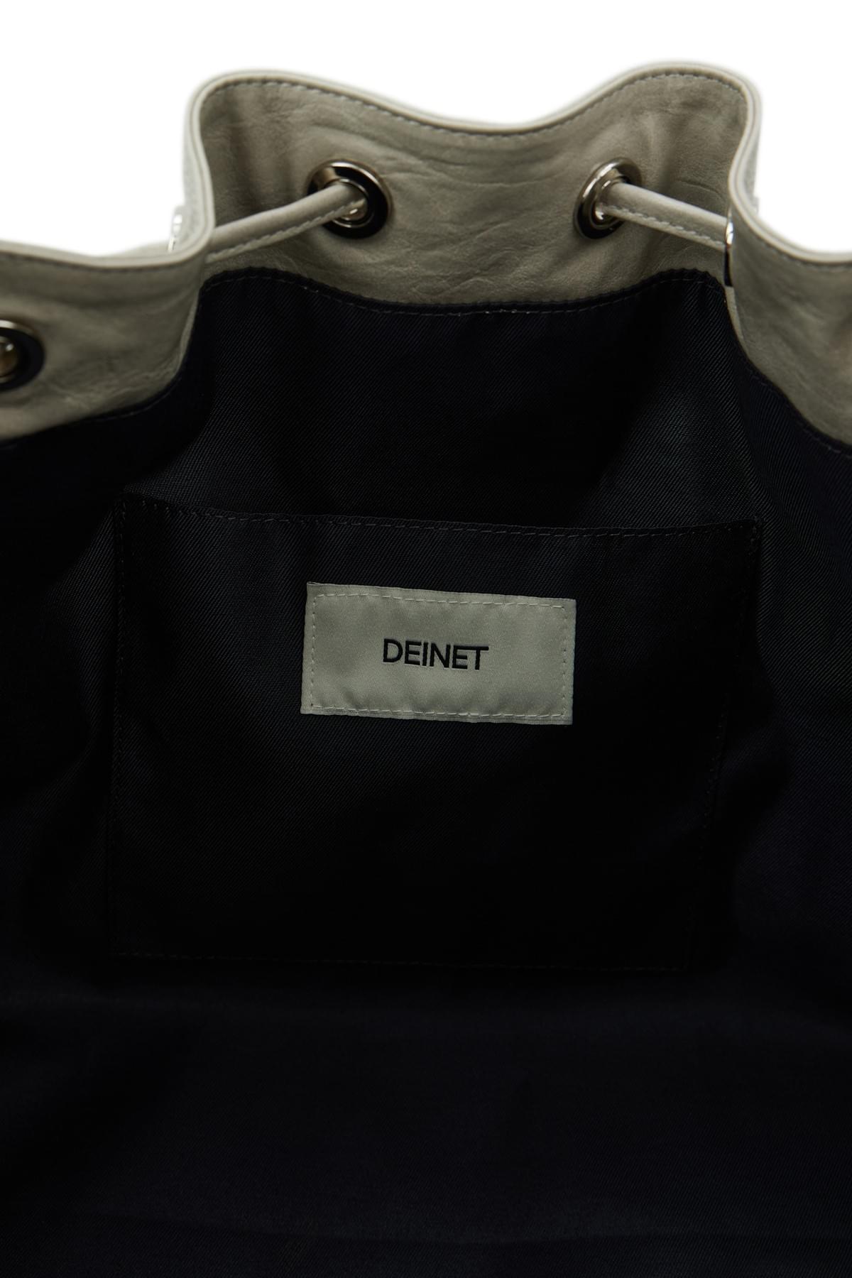 Deinet- stud belted bucked bag