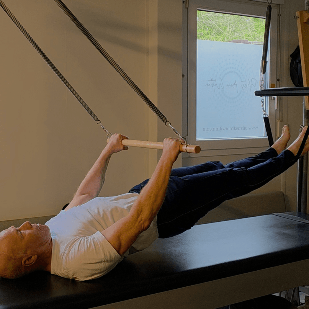 Tim Pilates instructor at Pilates From Within Haslemere doing self practice on the Cadillac Tim Pilates instructor at Pilates From Within Haslemere doing self practice on the Cadillac