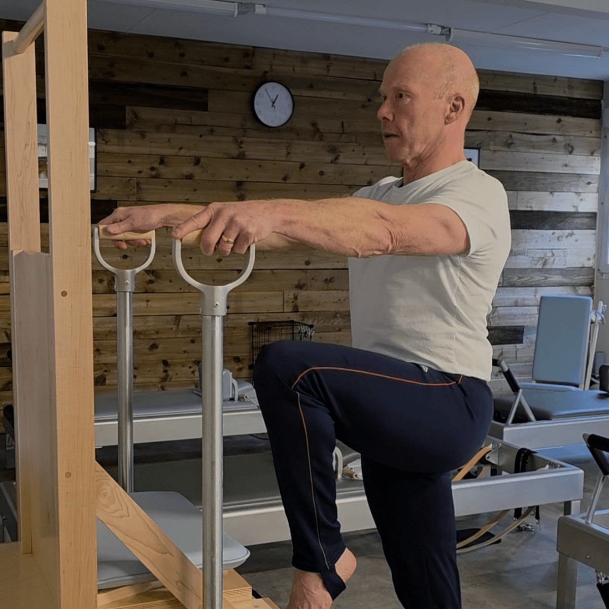 Tim Pilates instructor at Pilates From Within Haslemere practising chair Pilates independently to refine his technique Tim Pilates instructor at Pilates From Within Haslemere practising chair Pilates independently to refine his technique