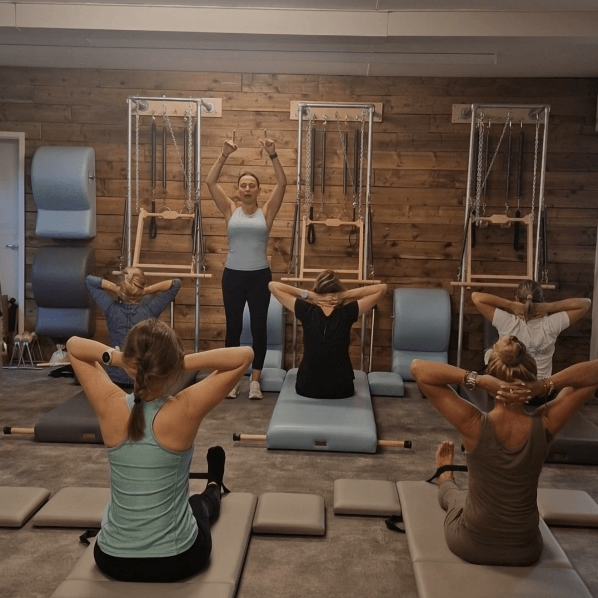 Classical Pilates teacher leading a  group Mat class at Pilates From Within Haslemere. All levels from beginners to professional athletes