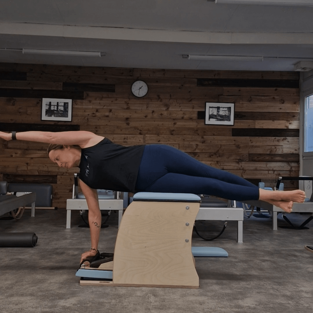 Karen studio owner and Pilates educator at Pilates From Within Haslemere doing self practice on the Pilates chair Karen studio owner and Pilates educator at Pilates From Within Haslemere doing self practice on the Pilates chair
