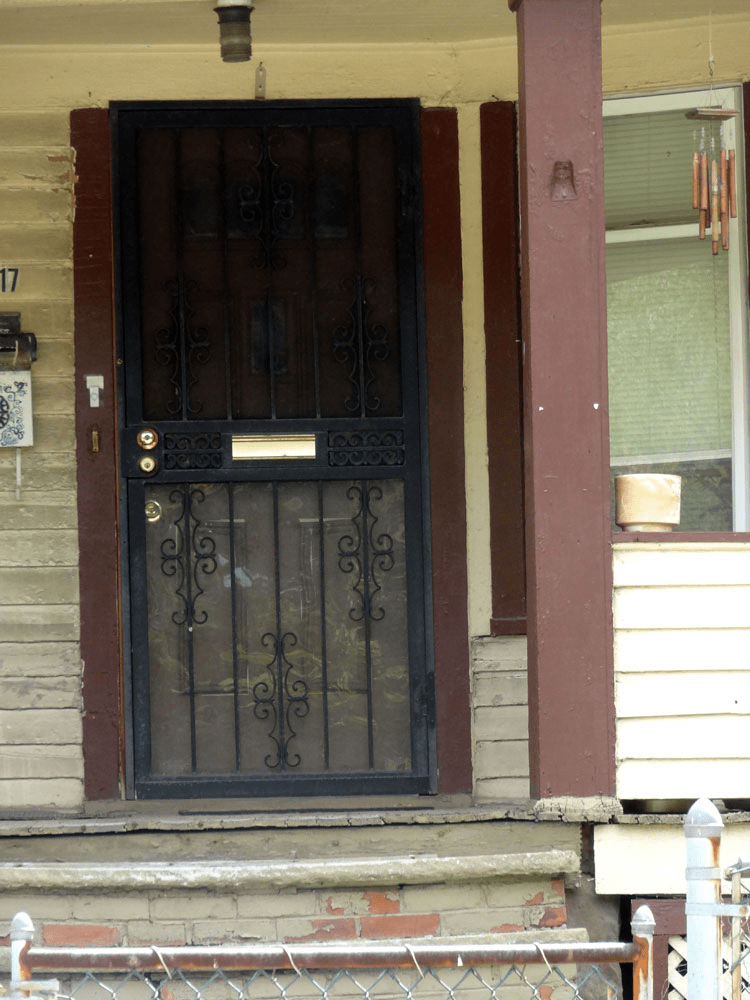 Metal screen door with mail slot