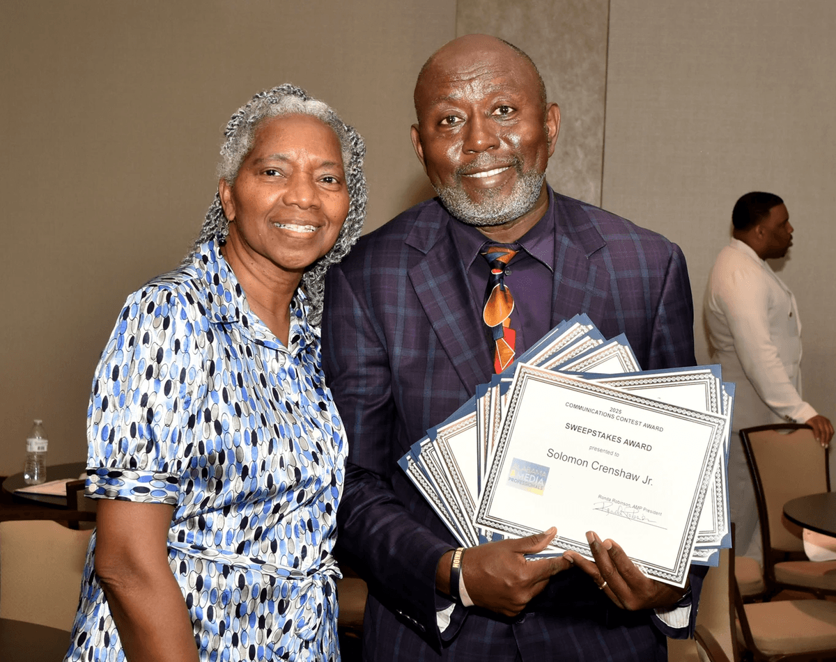 Solomon Crenshaw, Jr., with his wife Nancy, displays the collection of awards he received during the AMP Awards Luncheon in April 2025.   (Photo: Joseph DeSciose)