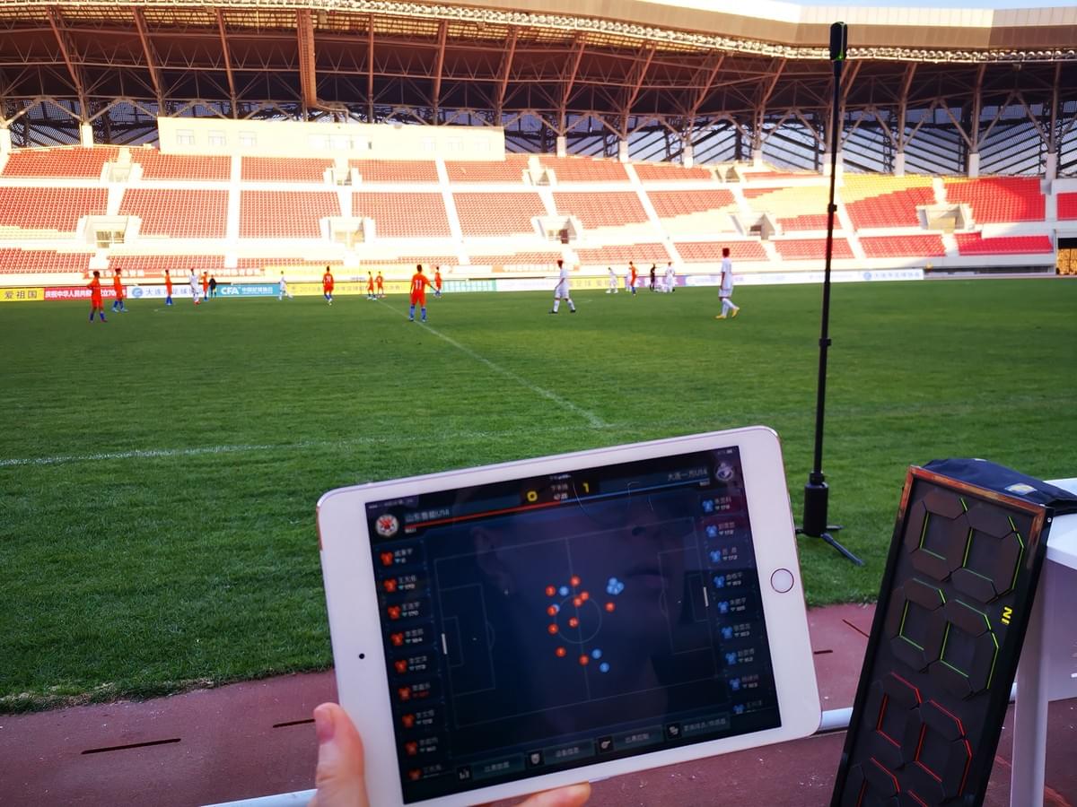 Football trackers used by coaches to monitor player stats and formation during National Youth Super League.