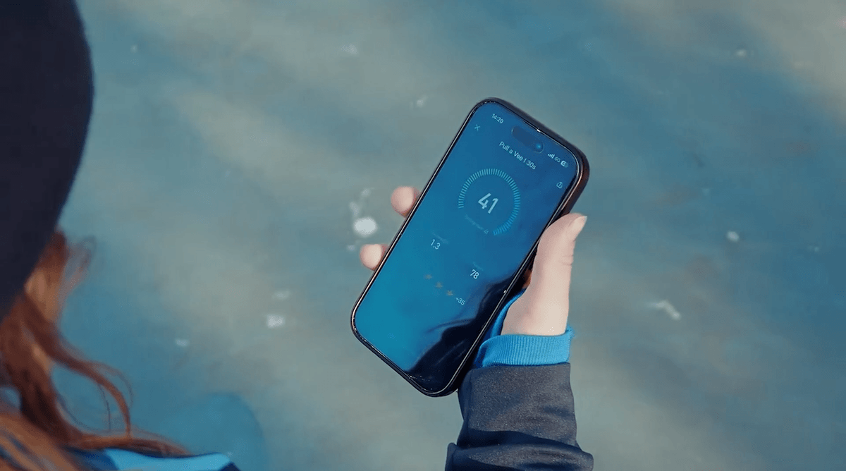 A young female player reviewing her technical drill results on the INSAIT JOY App after using the Gengee smart football with connected ball technology.