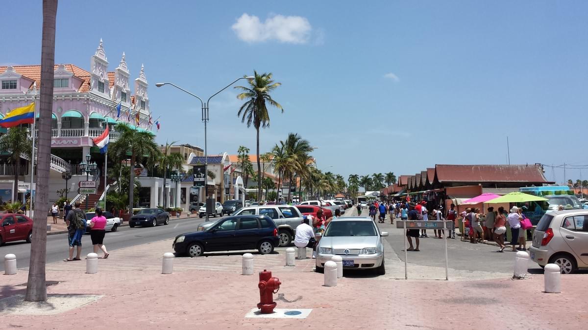 Cruise port in Oranjestad, Aruba, showing international boutiques and local shops.