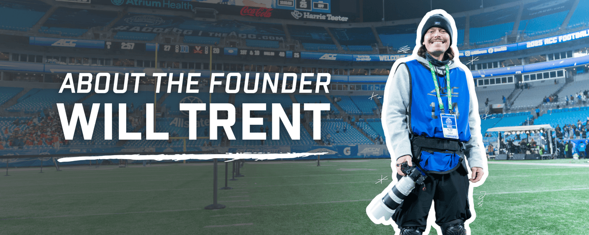 Image is of Will Trent holding a camera and posing for a picture on the field of a large stadium. The on-screen text reads "About the Founder: Will Trent" Image is of Will Trent holding a camera and posing for a picture on the field of a large stadium. The on-screen text reads "About the Founder: Will Trent"