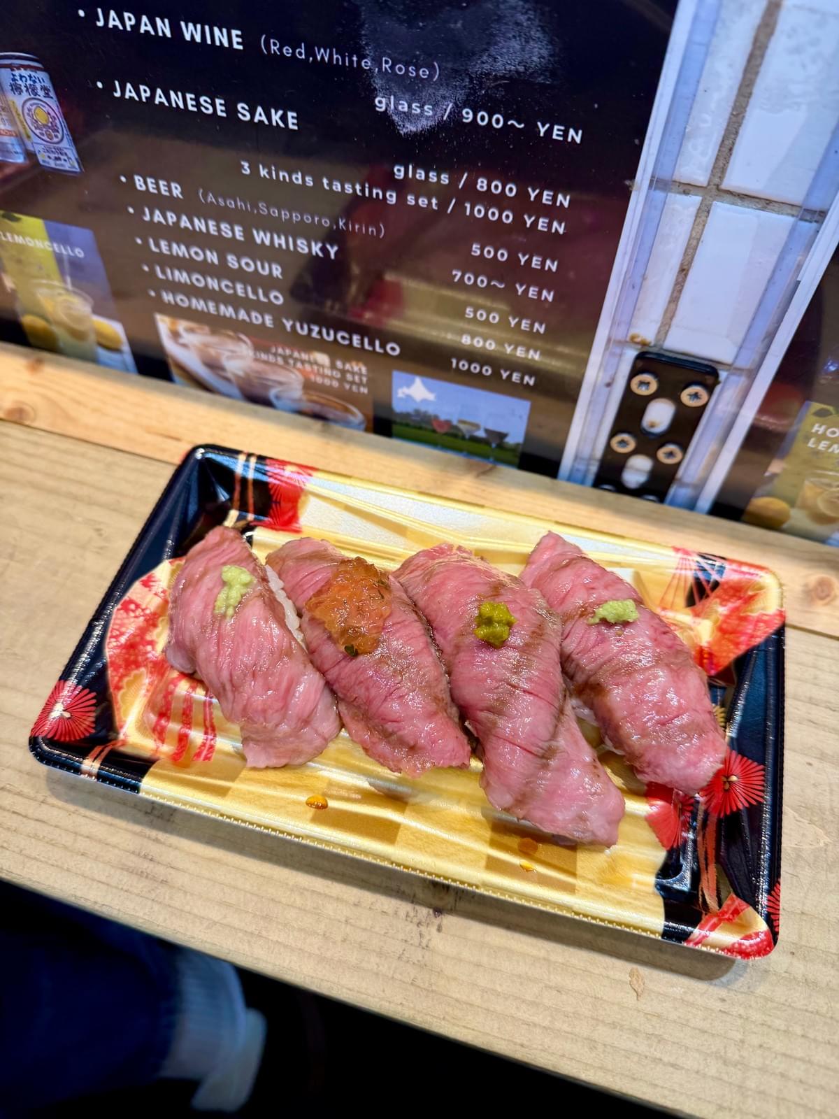FamTripping Japan trip with the Devani and Ali family exploring Tsukiji Outer Market food stalls in Tokyo in summer 2026.