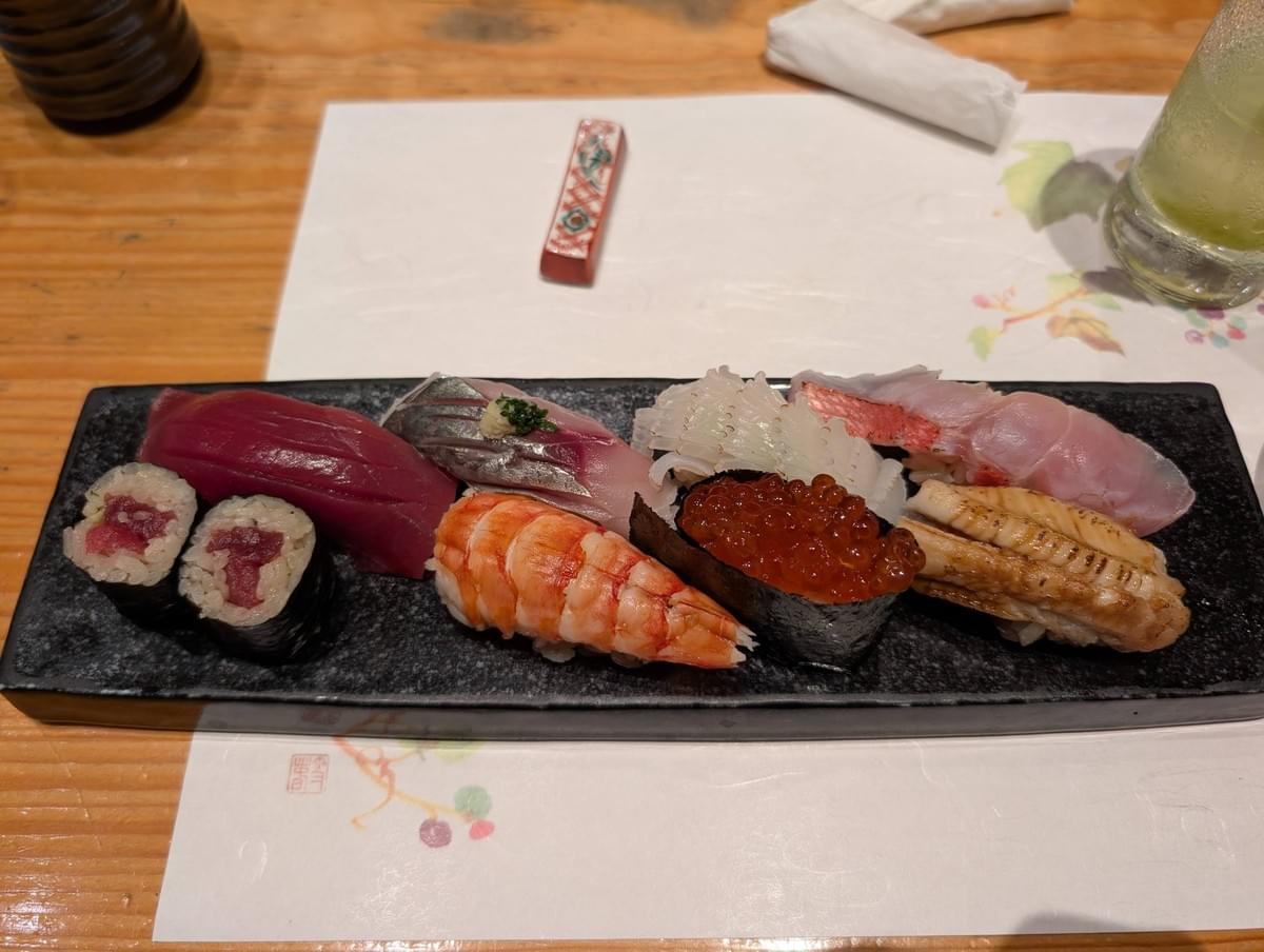 FamTripping Japan trip with the Devani and Ali family at the omakase counter at Sushi Kyotatsu Ark Hills South Tower in Tokyo in summer 2026.