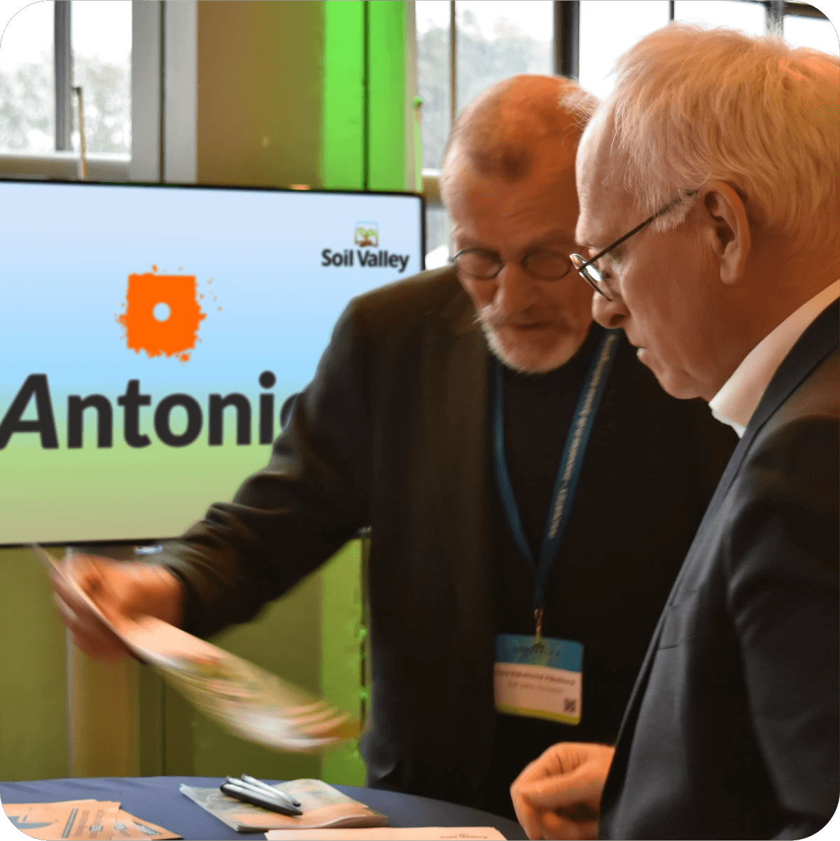 Two men attending an event hosted by HAL24K Agri on soil health and data-driven agriculture