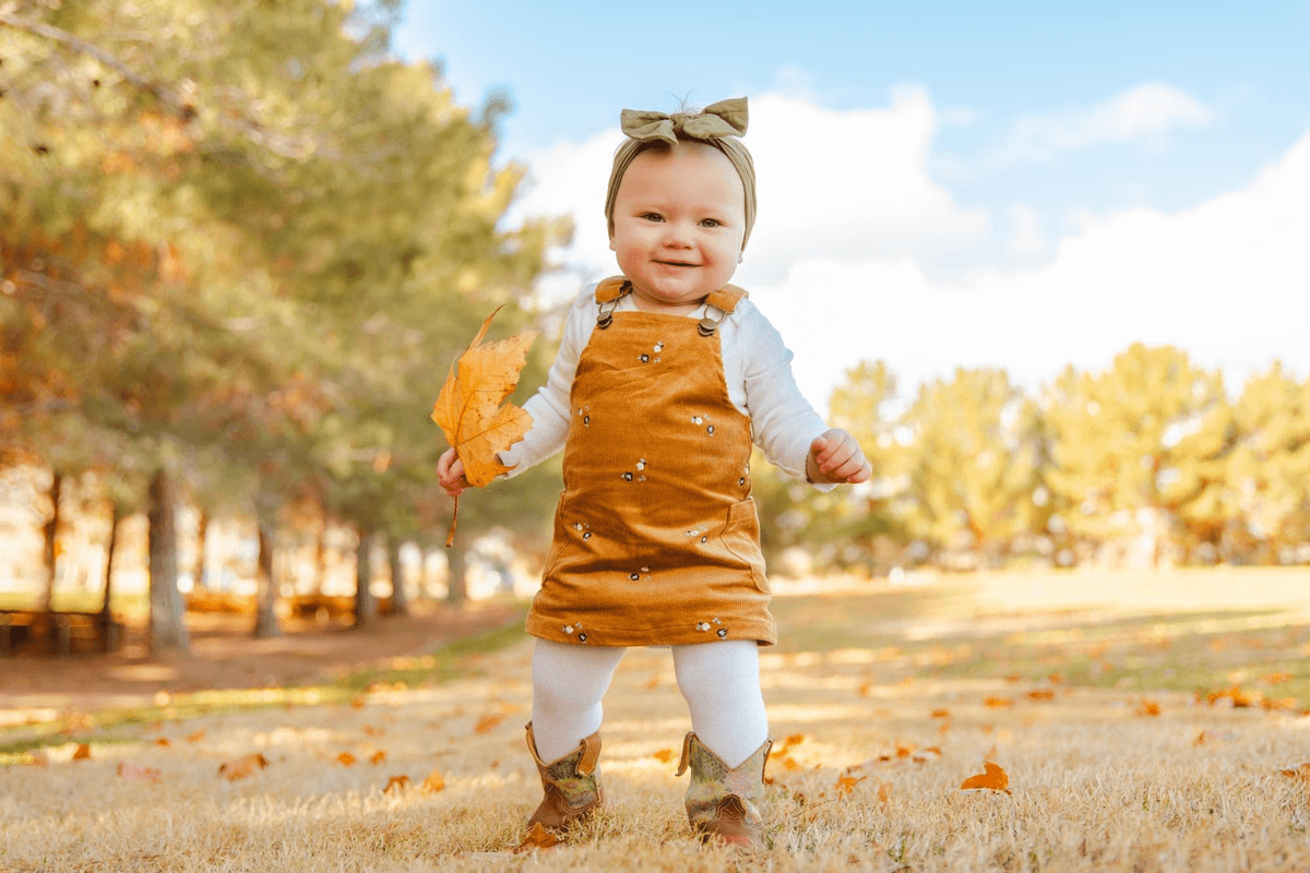 toddler running at Boulder City park in spring