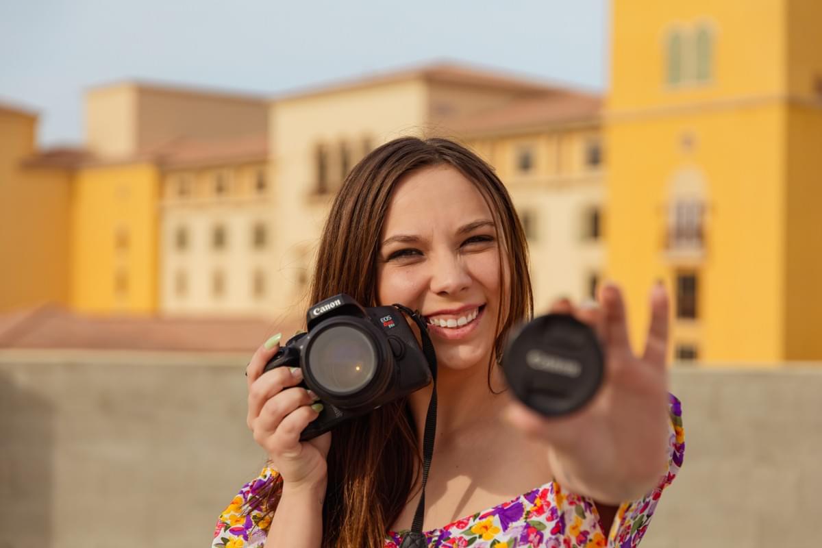 Photographer standing near a highway work zone, capturing a behind-the-scenes moment in a unique Las Vegas location