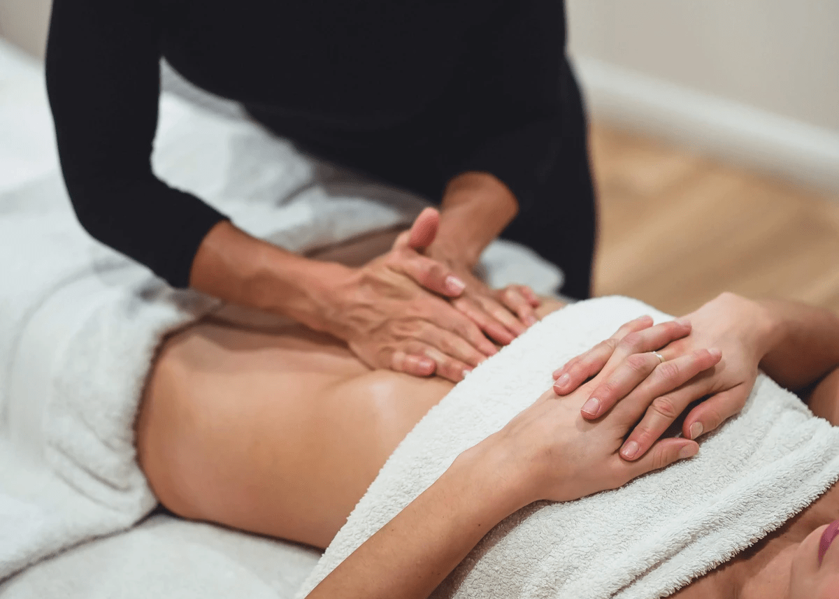 Therapist performing a power touch massage