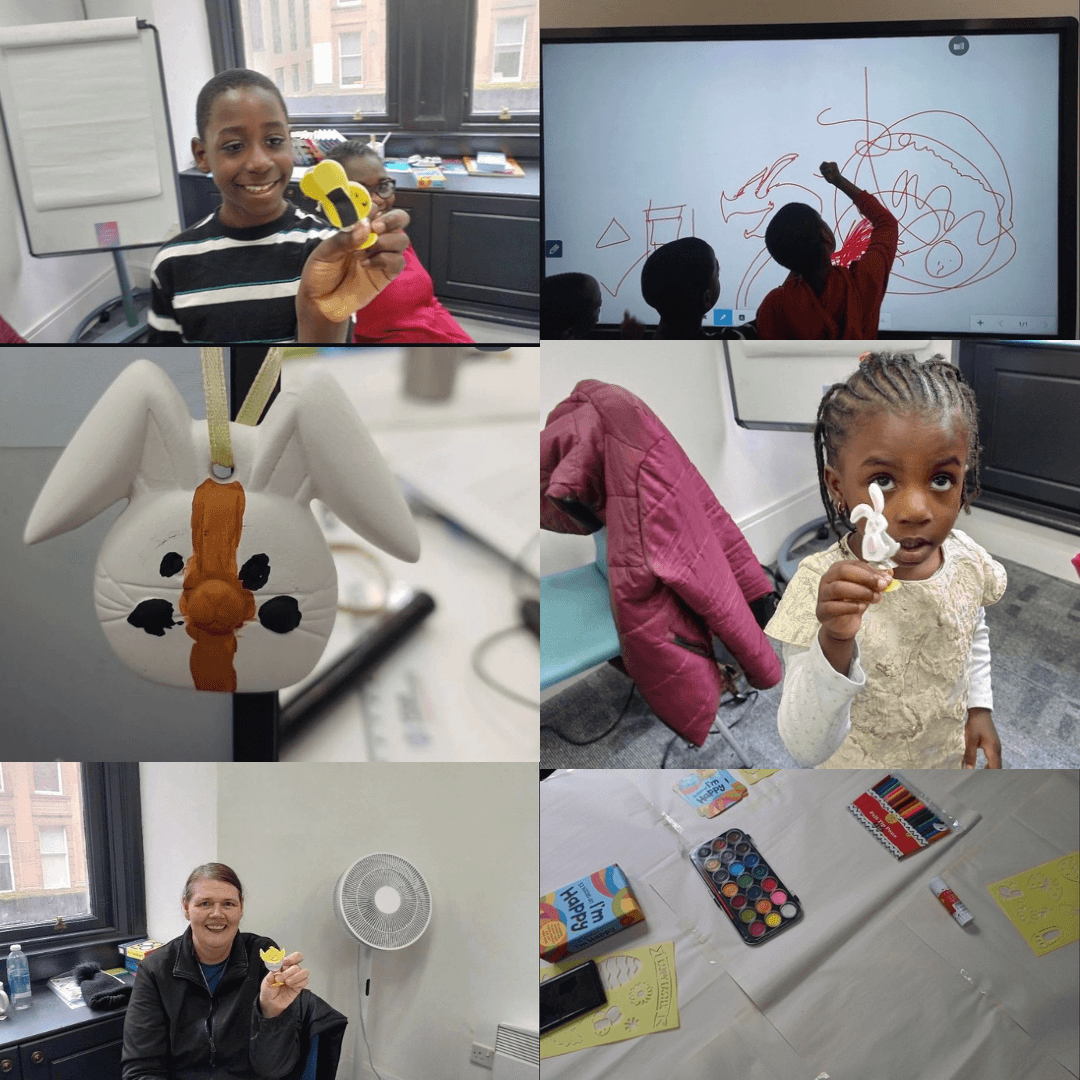 Children  in a classroom making and showing bunny crafts, with art supplies and drawings on a whiteboard.