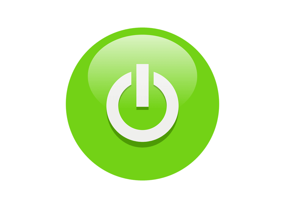 A circular green button featuring a white power symbol at its center. The symbol consists of a vertical line intersecting the top of a broken circle—an internationally recognized icon for powering on or off electronic devices. The background is a gradient of dark purple, which contrasts sharply with the bright green button, making it visually prominent. The design is sleek and modern, evoking themes of activation, control, and digital readiness. It may represent user interface elements, tech branding, or symbolic prompts for engagement and decision-making