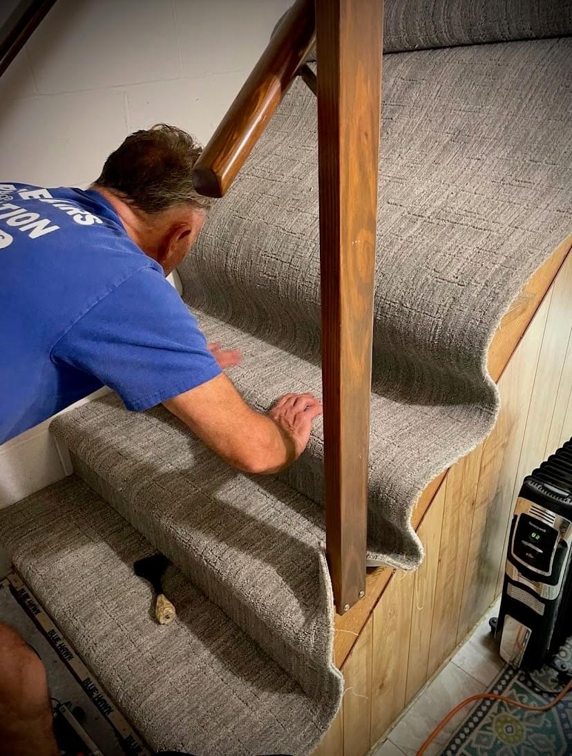 Serge installing carpet runner